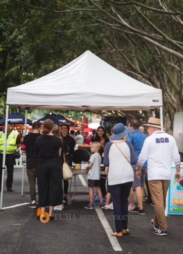 a group of people standing in a parking lot