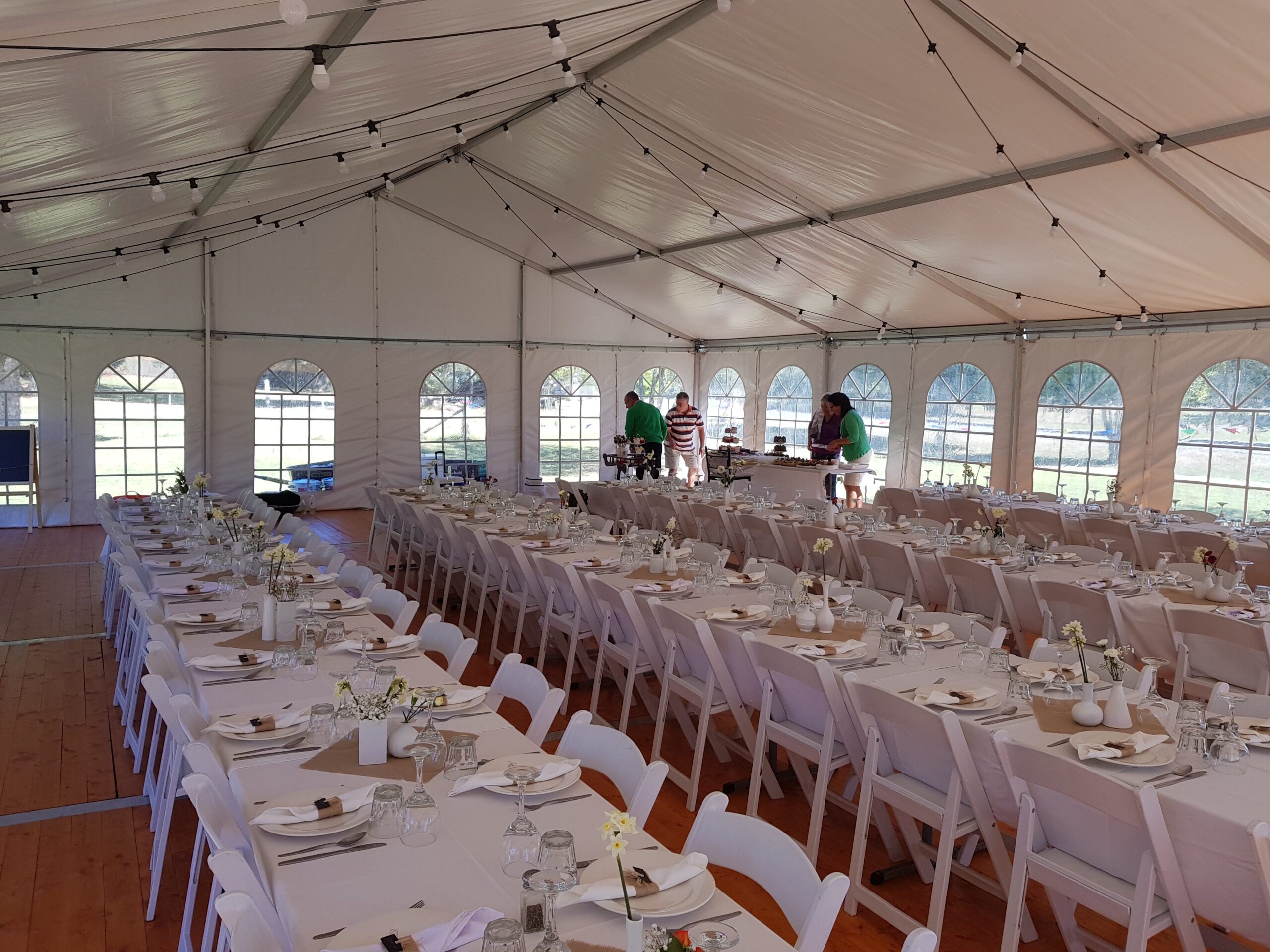 Event-Rentals-Hire-Feature-Marquee-Festoons-Window-Walls-Americanas Wedding reception setup in a marquee with windows and hanging lights