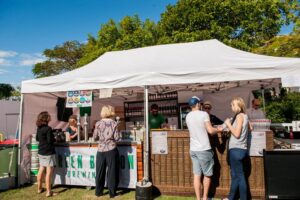 a group of people standing in front of a tent