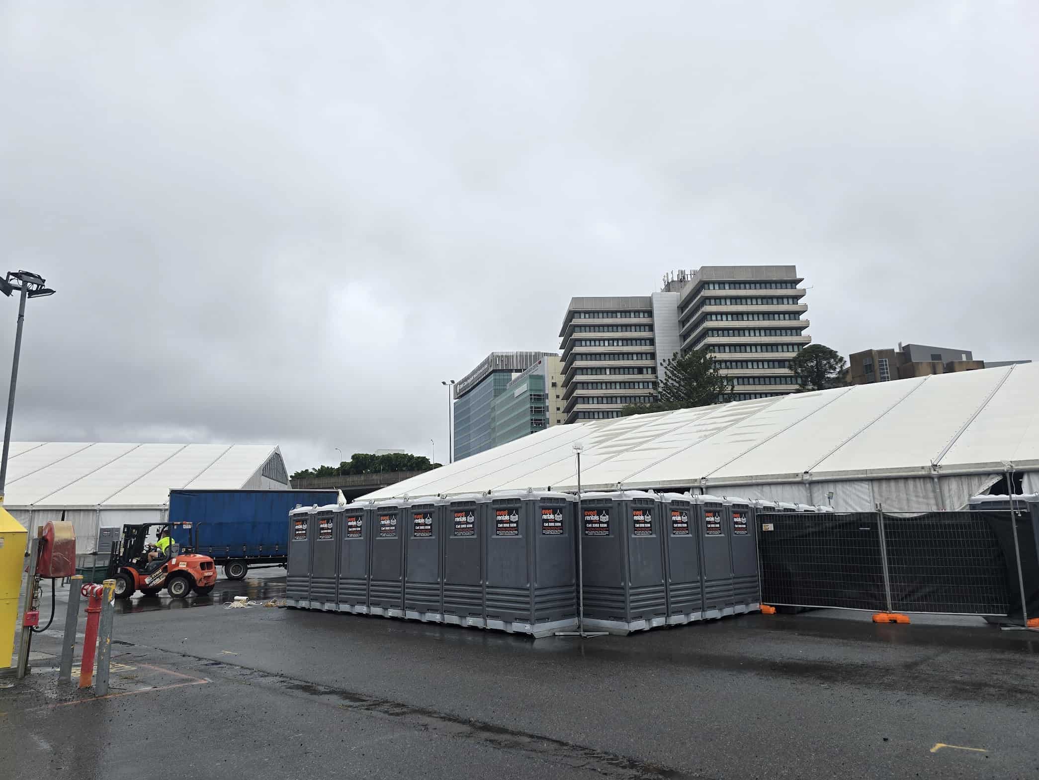 Temporary fencing, portable toilets and marquee at Brisbane Showgrounds