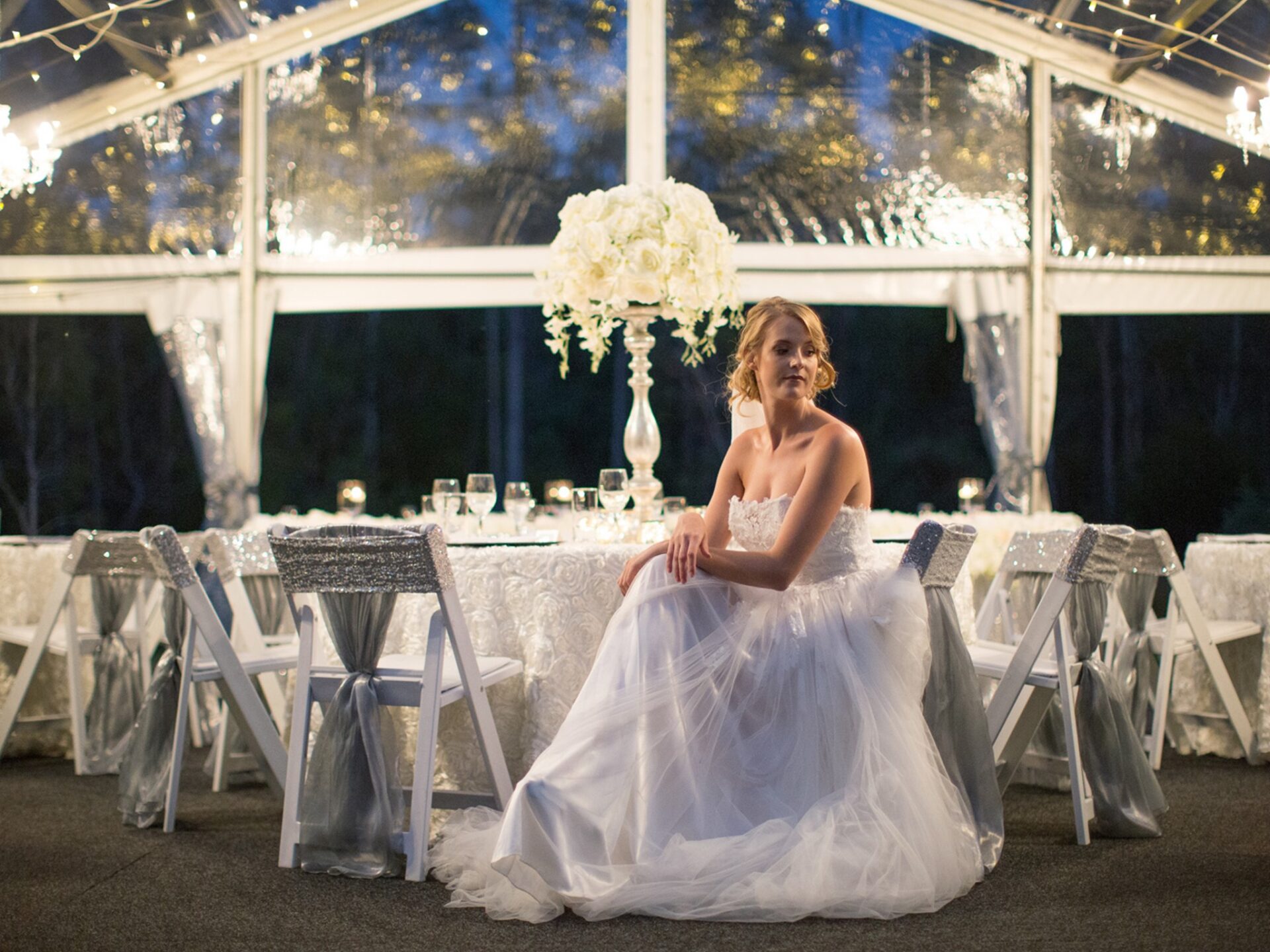 er4 bride sitting at table in marquee