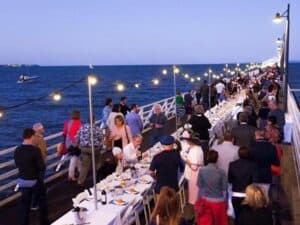 dinner event on pier with hanging lights